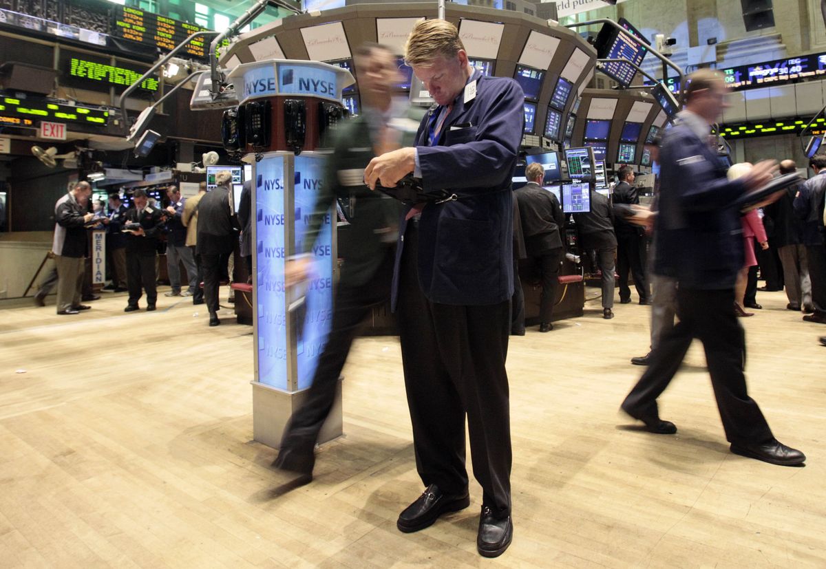 Traders work on the floor of the New York Stock Exchange on Tuesday. (Associated Press / The Spokesman-Review)