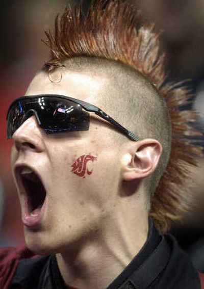 
Cougars fan Mason Tejera shows off his colorful style. The S-R
 (Christopher Anderson The S-R / The Spokesman-Review)