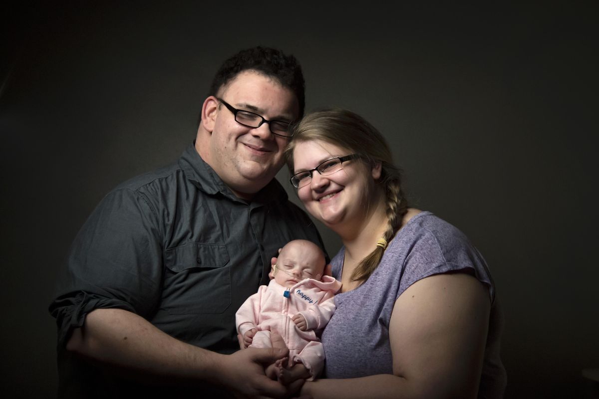 Wil and Whitney Spilker are the parents to baby Willow, who was born premature at 27 weeks and weighed less than one pound at birth. Every time she reached a whole number in weight, the nursing staff celebrated with a certificate. After 3 months in NICU, she left the hospital  weighing five pounds. (Colin Mulvany / The Spokesman-Review)