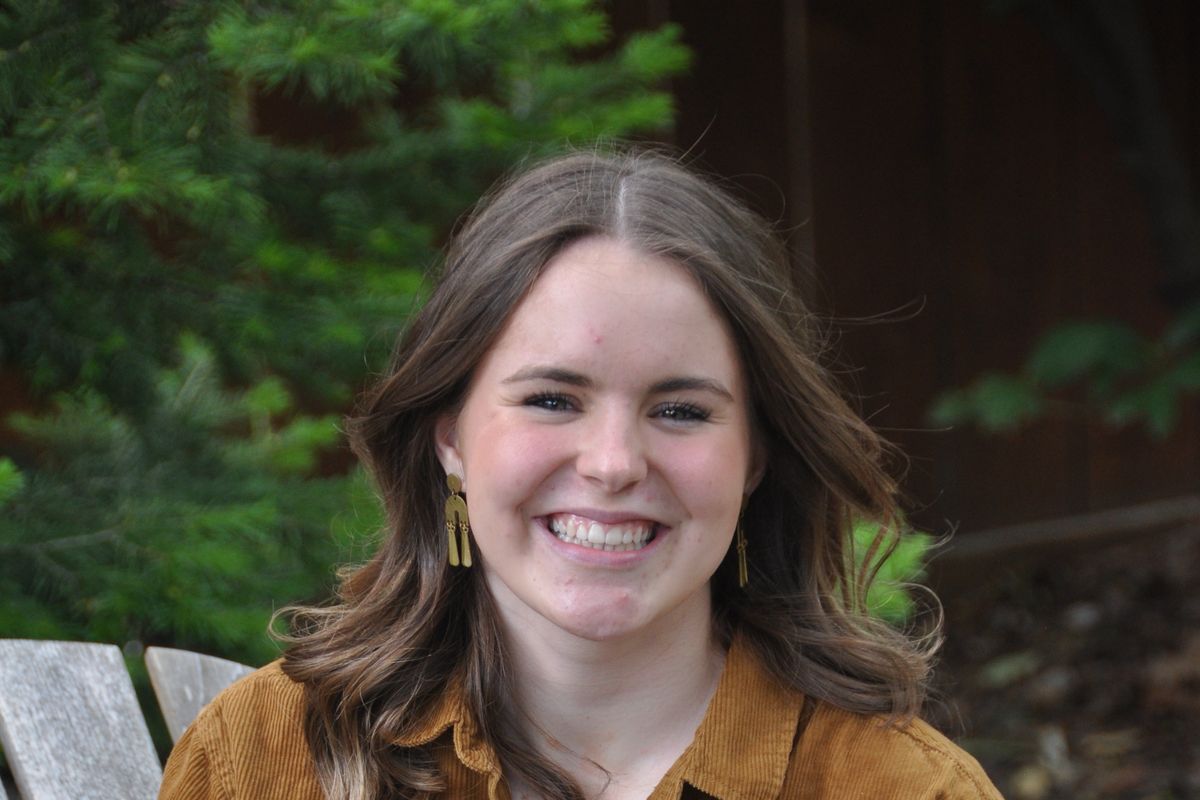 Ruthie Dierdorff is graduating valedictorian with The Oaks Classical Christian Academy senior class of 2021. Dierdorff sits by a fire pit she and her family built when everyone was home for the summer last year. (Courtesy)