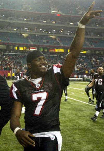 
Michael Vick has agreed to spend the next decade greeting Falcons fans. 
 (Associated Press / The Spokesman-Review)