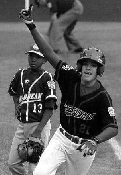 
Michael Memea rounds third after game-winning homer.
 (Associated Press / The Spokesman-Review)