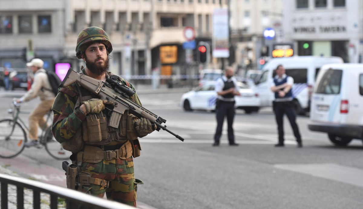 A Belgian Army soldier stands outside Central Station after a reported explosion in Brussels on Tuesday, June 20, 2017. (Geert Vanden Wijngaert / Associated Press)