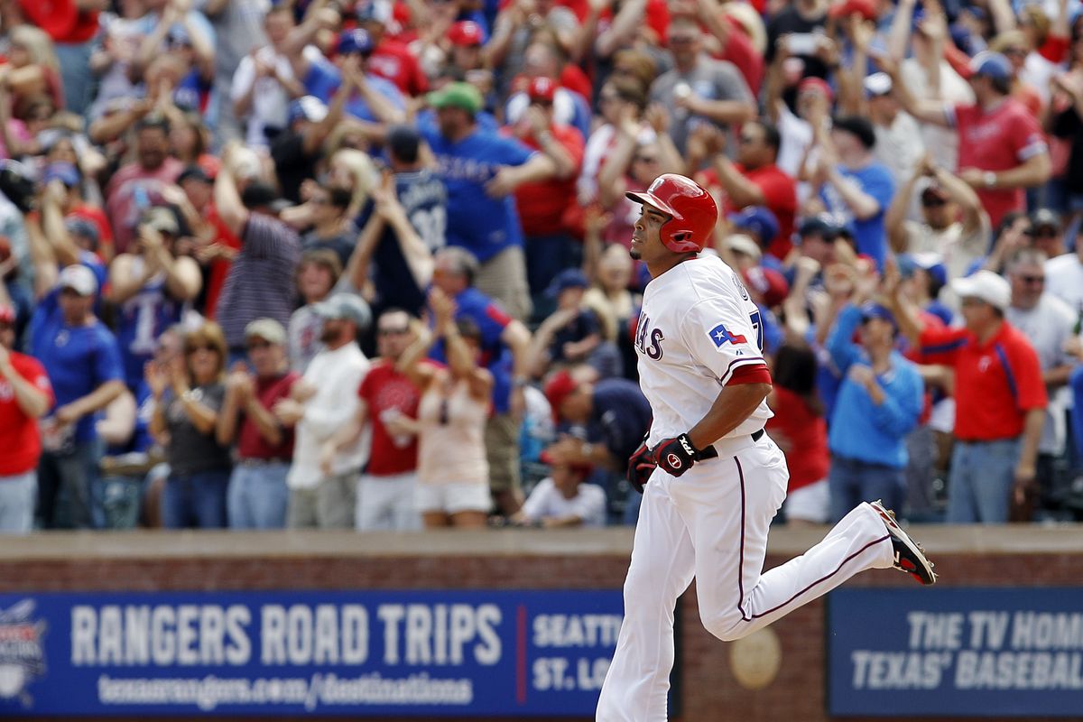 Texas fans cheer Nelson Cruz’s fifth-inning grand slam. (Associated Press)