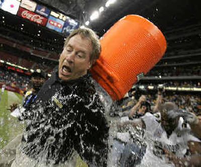 
Colorado coach Gary Barnett gets iced after his Buffaloes iced a Houston Bowl win over Mike Price's UTEP. 
 (Associated Press / The Spokesman-Review)