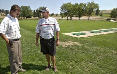 
Superintendent Todd Lupkes, left, and Washington State University golf coach Walt Williams discuss the new university practice facilities  at the WSU Palouse Ridge Golf Course. 
 (Brian Immel / The Spokesman-Review)