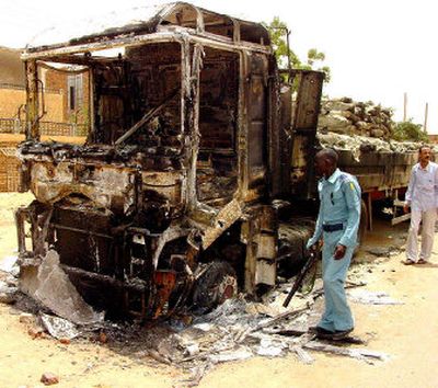 
A burned-out truck in the streets of Khartoum on Tuesday. Violence shook the Sudanese capital Tuesday after a morning of tense calm. 
 (Associated Press / The Spokesman-Review)