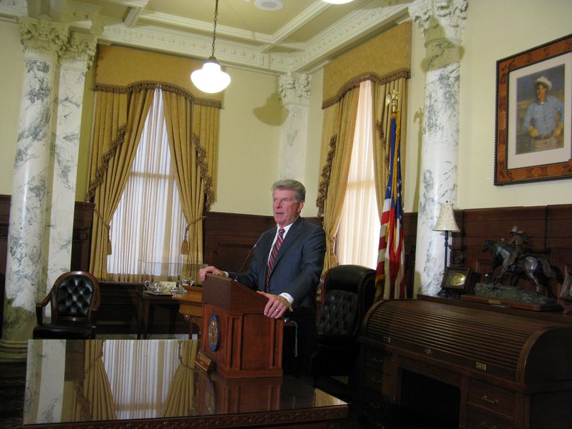 Gov. Butch Otter addresses reporters in his office after his State of the State message to lawmakers on Monday (Betsy Russell)