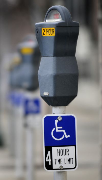 Disabled  parking signs have been added to some meters along Sprague and First avenues.  (Dan Pelle / The Spokesman-Review)