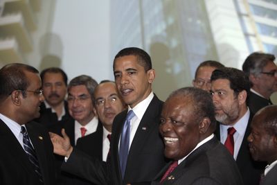 President Barack Obama is surrounded by leaders of the Americas during the official photo at the Summit of the Americas on Saturday in Port-of-Spain, Trinidad and Tobago.  (Associated Press / The Spokesman-Review)