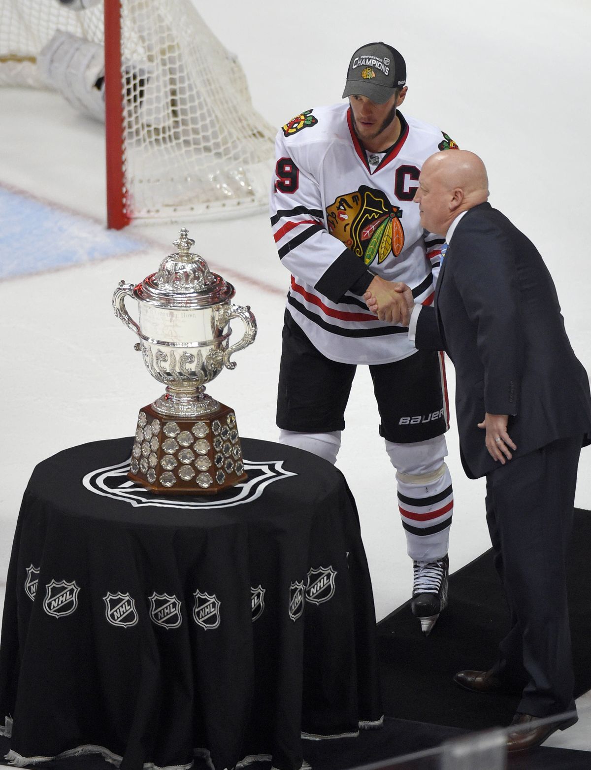 Blackhawks center and captain Jonathan Toews and his teammates have grown accustomed to receiving trophies, including their latest for winning the Western Conference. (Associated Press)