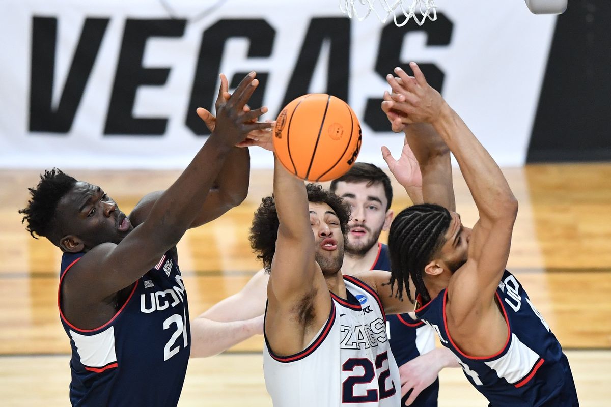 Gonzaga forward Anton Watson battles for a rebound against Connecticut