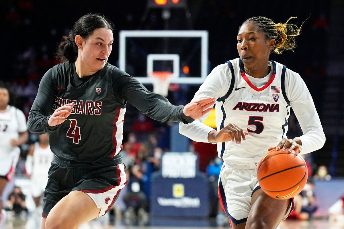 Arizona forward Koi Love (5) drives past Washington State guard Krystal Leger-Walker during the first half of an NCAA college basketball game Friday, Jan. 7, 2022, in Tucson, Ariz.  (Rick Scuteri)