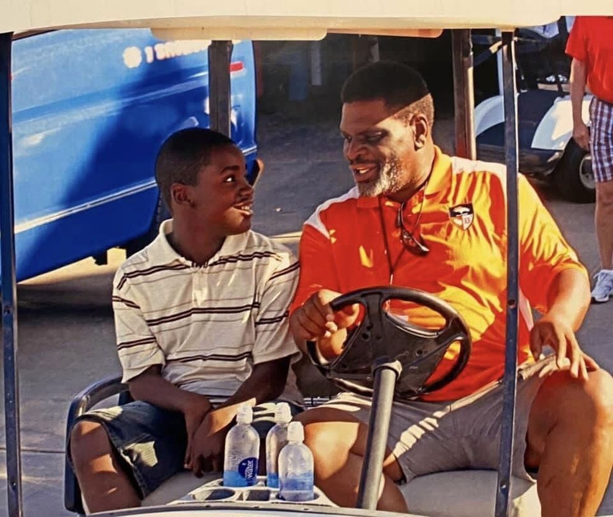 Graham Ike (left) used to spend time with grandfather Tom Graham, a former NFL linebacker, attending Denver Broncos alumni and community events before Graham died in 2017. (Courtesy/Ebony Graham)