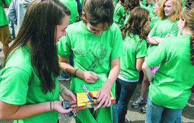 
Friends of accident victim Tom Everett, 17, gather at Ferris High School for a group picture after many ran   Bloomsday wearing green T-shirts in his honor.
 (Courtesy of Nick Follger / The Spokesman-Review)