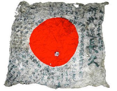 
This Japanese flag with wishes for good fortune and a safe return was presented to Heitaro Kodama, a young soldier in Niigata, Japan in 1940, and just returned to his family from Spokane with the help of Mukogawa Fort Wright Institute.  
 (Courtesy of Toshiaki Kodama / The Spokesman-Review)