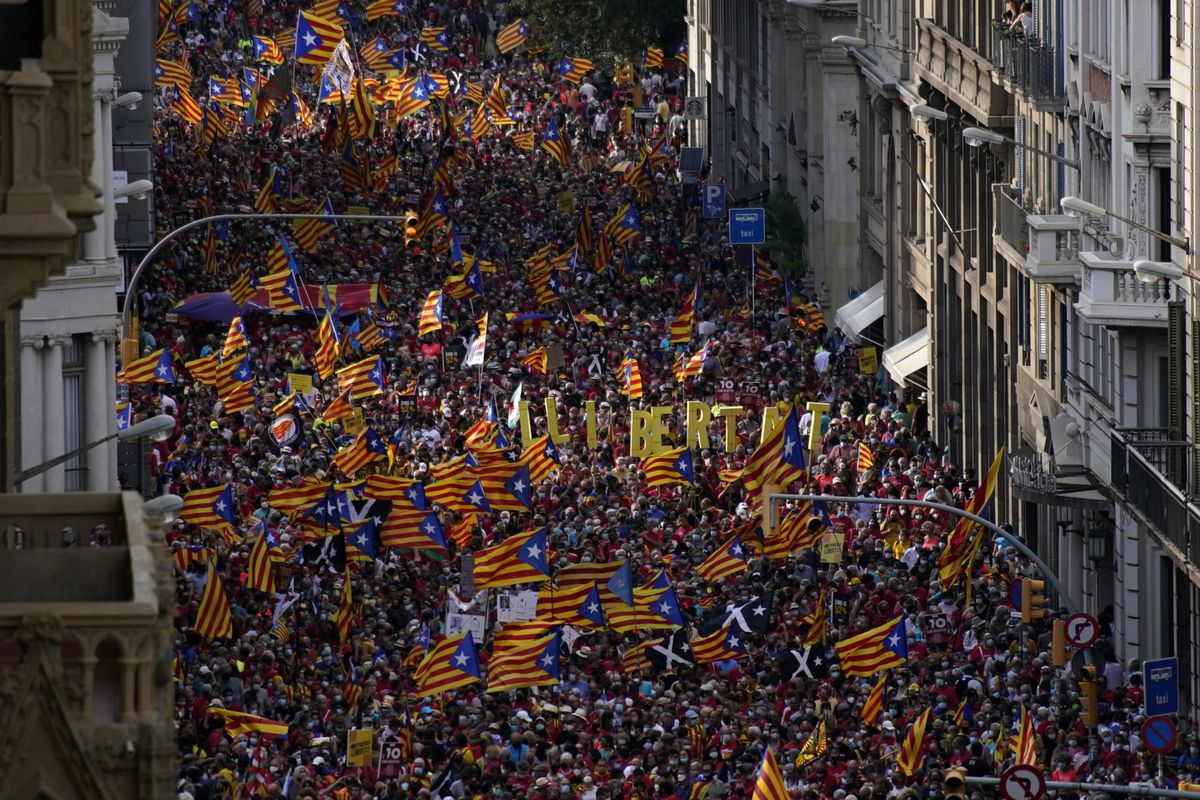 Demonstrators march during the Catalan National Day in Barcelona, Spain, Saturday, Sept. 11, 2021. Thousands of Catalans have rallied for independence from the rest of Spain in their first major mass gathering since the start of the pandemic. The march in Barcelona on Saturday comes before a meeting between regional leaders in northeast Catalonia and the Spanish government.  (Joan Mateu Parra)