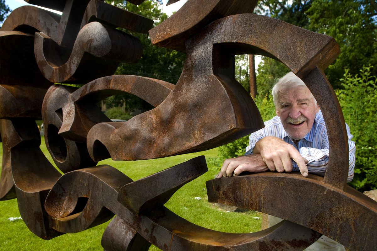In this 2010 file photo, Harold Balazs, 81, stands behind his rusted steel "New Moon" sculpture, part of a major Balazs exhibit opening at the Northwest Museum of Arts and Culture. (Colin Mulvany / The Spokesman-Review)