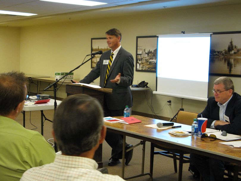 Deputy Attorney General Brian Kane addresses a crowd of 80-plus at an open government seminar in McCall on Monday; at right is Attorney General Lawrence Wasden (Betsy Z. Russell)
