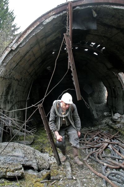 A mine rescuer leaves  the Raspadskaya mine, Russia’s largest underground coal mine,  on Sunday.  (Associated Press)