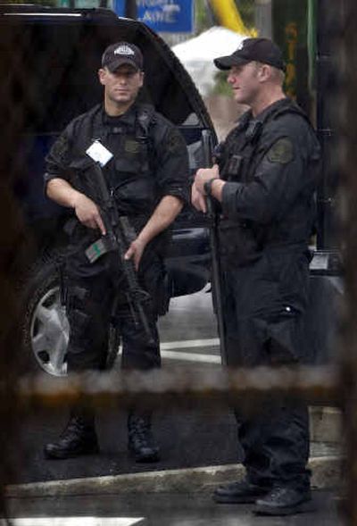 
Sheriff's personnel stand guard at the Fleet Center in Boston on Saturday during preparations for the Democratic National Convention starting Monday.
 (Associated Press / The Spokesman-Review)