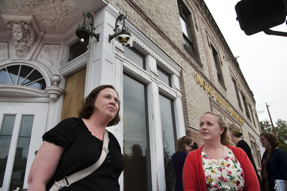 EWU student Jessica Bell, left, and Emily Vance, project employee for the Historic Preservation Office, visit the More Better Building on Friday in East Central Neighborhood. (Dan Pelle)