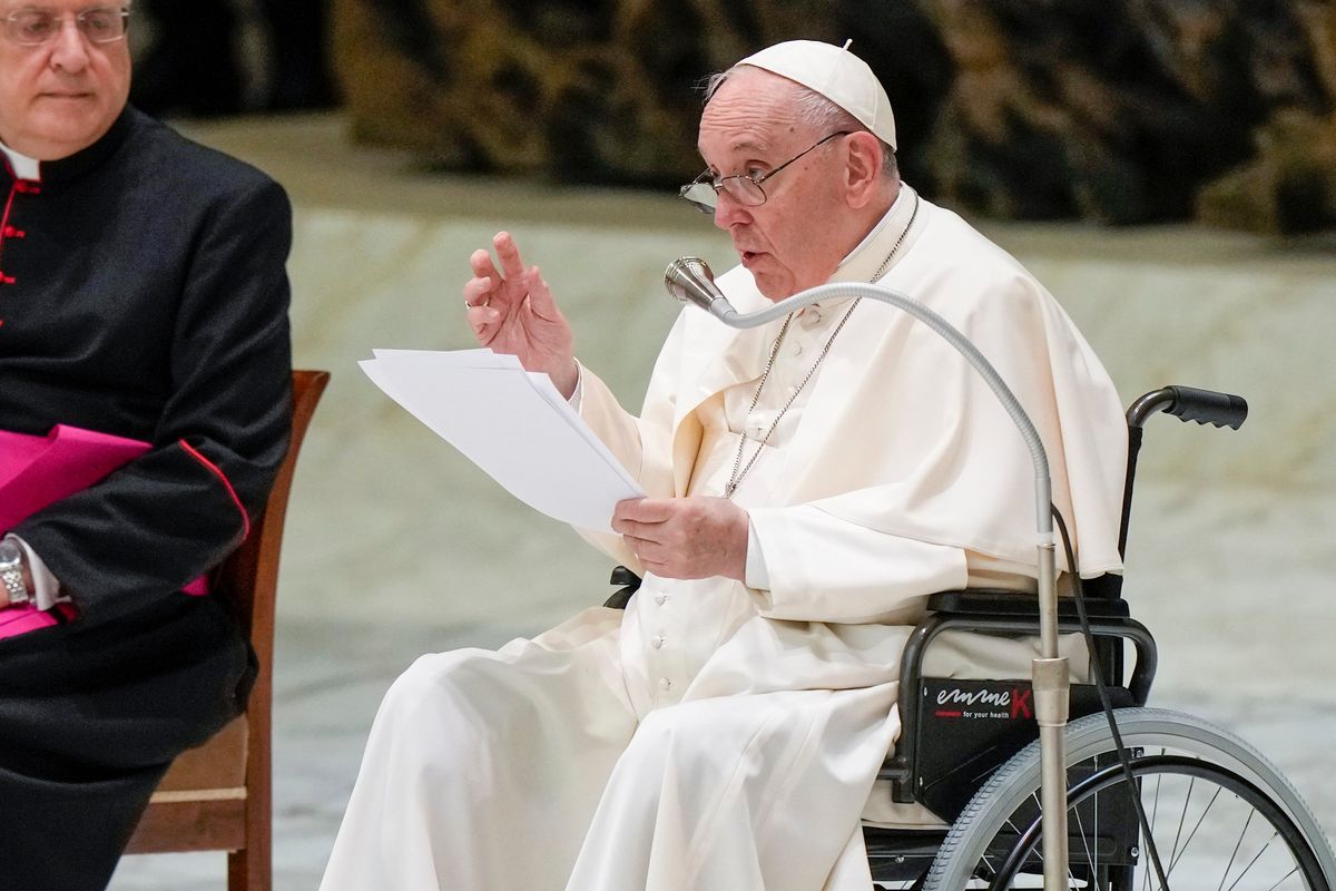 Pope Francis in a wheelchair delivers his address during an audience with members of the Italian Civil Aviation Authority (ENAC) in the Paul VI Hall at The Vatican, Friday, May 13, 2022. Pope Francis suffers from strained ligaments in his right knee.  (Andrew Medichini)