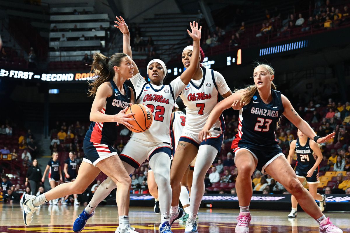 Gonzaga guard Allie Turner, left, heads to the basket as Mississippi guard Denim Deshields and center Desrae Kyles defend during the first round of the NCAA Tournament.  (COLIN MULVANY/THE SPOKESMAN-REVIEW)