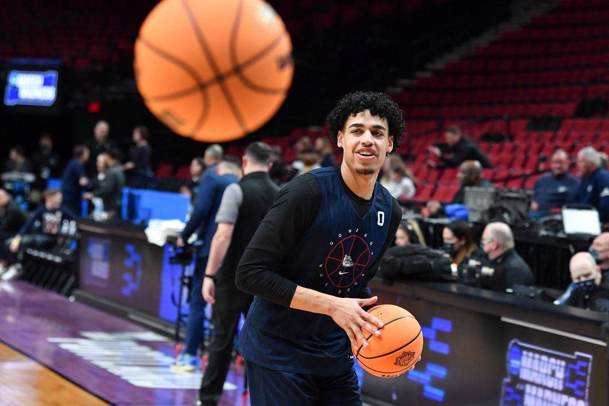 Gonzaga guard Julian Strawther smiles between shots during practice Wednesday at the Moda Center in Portland.  (Tyler Tjomsland / The Spokesman-Review)