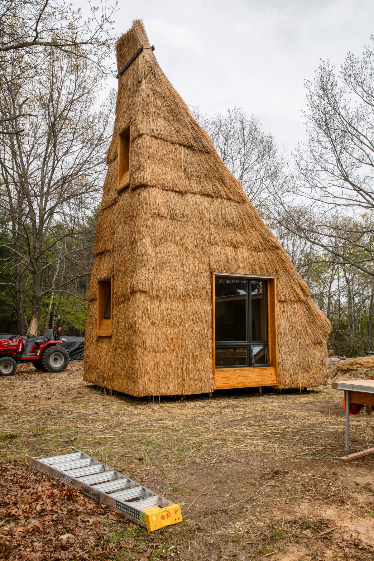 A straw house, an architectural experiment by a Princeton University team, stands near Hudson, N.Y. The house is 28 feet tall and has a sleeping loft, a daybed, five windows, and a kitchen.  (New York Times )