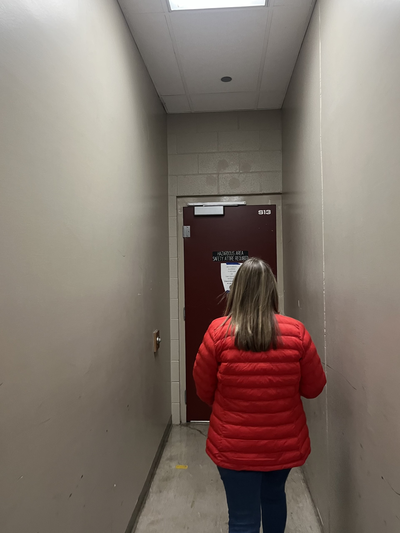 North Central High School principal Tami McCracken opens the door to the former woodshop classroom, now storage closet, in the aging basement of the school they call “the tunnel.”  (Elena Perry/The Spokesman-Review)