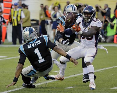 Denver Broncos Von Miller (58) strips the ball from Carolina Panthers Cam Newton (1) during the first half of the NFL Super Bowl 50 football game Sunday, Feb. 7, 2016, in Santa Clara, Calif. The Broncos recovered the fumble for a touchdown. (David J. Phillip / Associated Press)