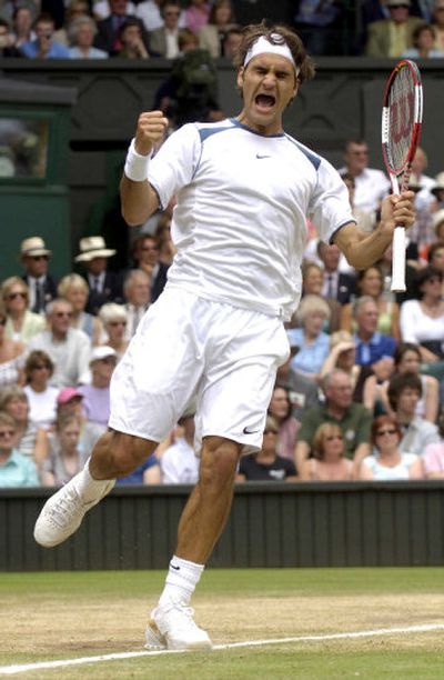 
Defending champion Roger Federer celebrates victory over Lleyton Hewitt. 
 (Associated Press / The Spokesman-Review)