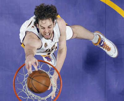 
Los Angeles Lakers forward Pau Gasol dunks during the first quarter Sunday on the way to 36 points. Associated Press
 (Associated Press / The Spokesman-Review)