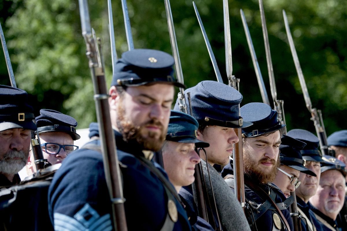 Members of the Union Infantry line up before battle during the Civil War reenactment at Deep Creek Farm near Medical Lake on Sunday, May 28, 2017. (Kathy Plonka / The Spokesman-Review)