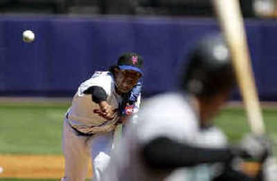 
New York Mets pitcher Pedro Martinez delivers a pitch in the second inning Saturday. 
 (Associated Press / The Spokesman-Review)