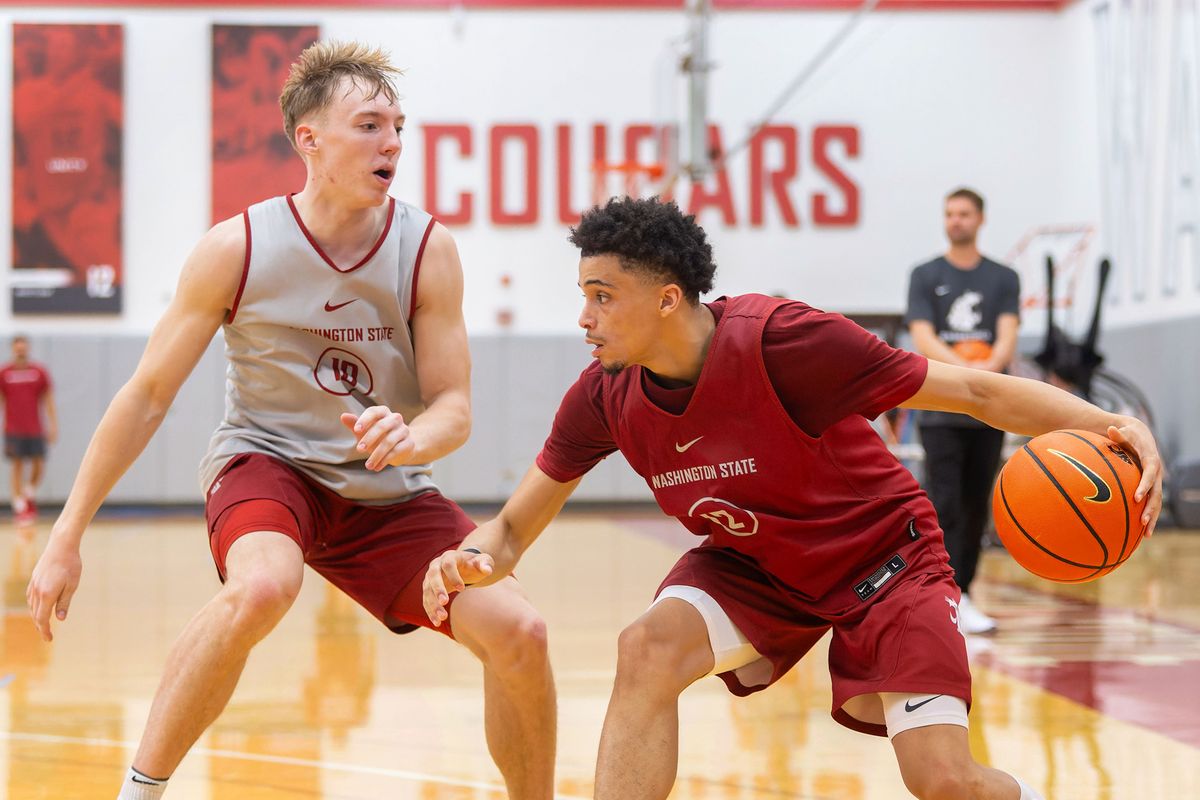 Washington State guard Isaiah Watts, right, drives around Parker Gerrits during a practice last month in Pullman.  (Geoff Crimmins/For The Spokesman-Review)