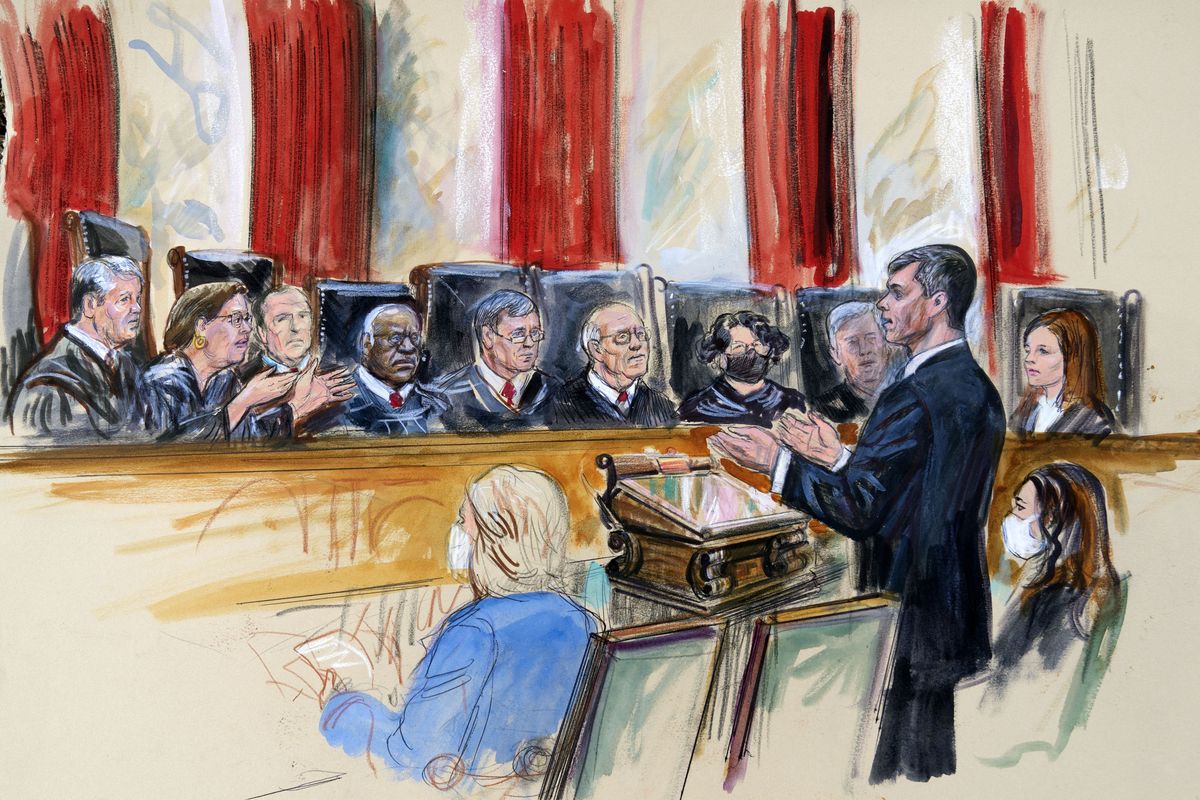 This artist sketch depicts Mississippi Solicitor General Scott Stewart, standing while speaking to the Supreme Court, Wednesday, Dec. 1, 2021, in Washington. Center for Reproductive Rights Litigation Director Julie Rikelman is seated right. Justices seated from left are Associate Justice Brett Kavanaugh, Associate Justice Elena Kagan, Associate Justice Samuel Alito, Associate Justice Clarence Thomas, Chief Justice John Roberts, Associate Justice Stephen Breyer, Associate Justice Sonia Sotomayor, Associate Justice Neil Gorsuch and Associate Justice Amy Coney Barrett.  (Dana Verkouteren)