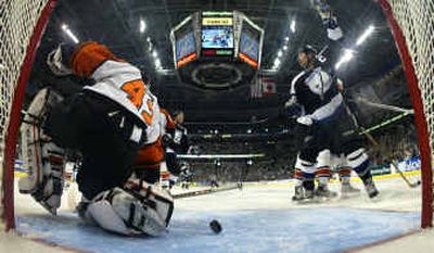 
Tampa Bay's Dave Andreychuk, right, reacts after scoring the Lightning's first goal against Philadelphia Flyers goaltender Robert Esche. Tampa Bay's Dave Andreychuk, right, reacts after scoring the Lightning's first goal against Philadelphia Flyers goaltender Robert Esche. 
 (Associated PressAssociated Press / The Spokesman-Review)