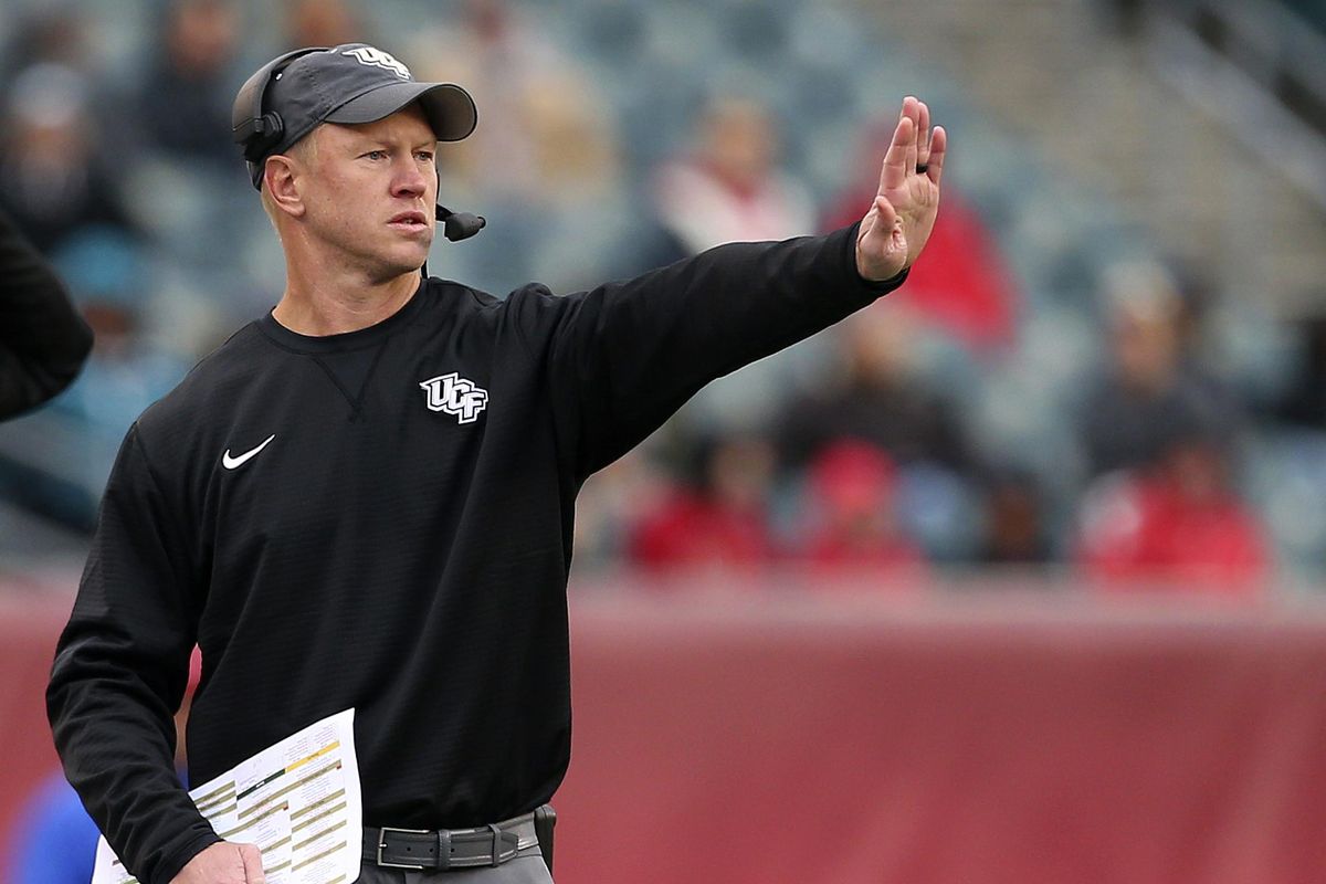 In this Saturday, Nov. 18, 2017, file photo, Central Florida head coach Scott Frost signals to his team during the third quarter of an NCAA college football game against Temple in Philadelphia. (Rich Schultz / Associated Press)