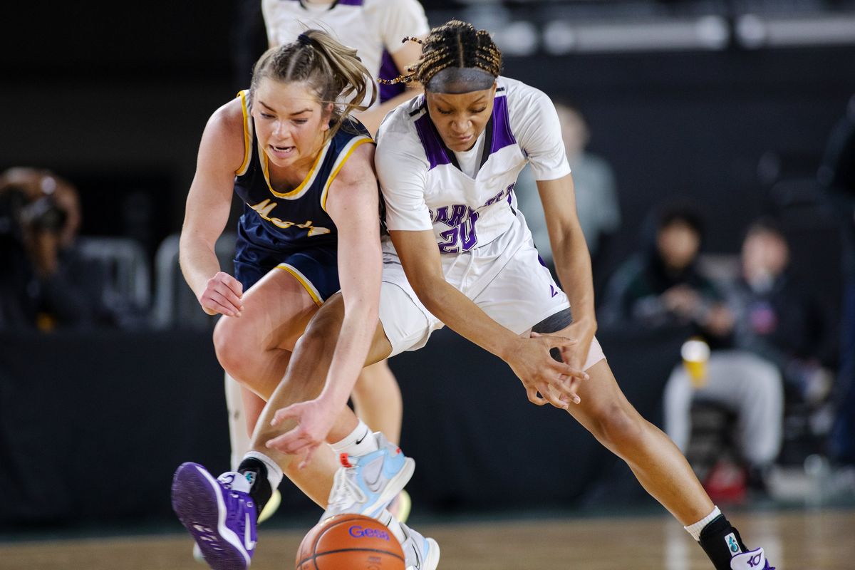 Mead’s Teryn Gardner, left, steals the ball from Garfield’s Rakiyah Jackson during action in the semi-finals of the 3A Girls State Basketball Tournament in Tacoma, Wash., on Friday, March 3, 2023. Mead lost the contest 63-54. They’ll play for 3rd place on Saturday.  (Patrick Hagerty/FOR THE SPOKESMAN-REVIEW)