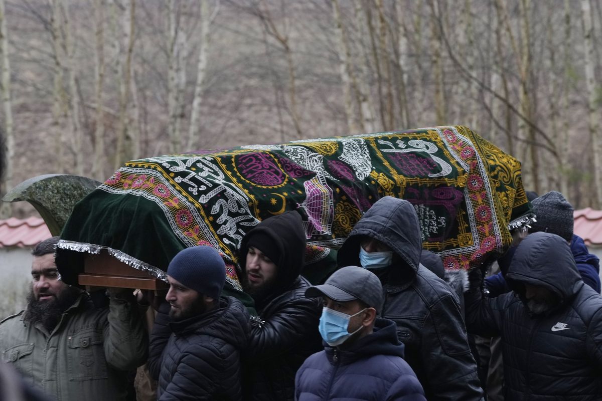 A local Muslim community buried a Yemeni migrant Mustafa Mohammed Murshed Al-Raimi, in Bohoniki, Poland, Sunday, Nov. 21, 2021. The person is one of about a dozen people from the Middle East and elsewhere who have died in a area of forests and bogs along the Poland-Belarus border amid a standoff involving migrants between the two countries. The burial took place in Muslim cemetery in Bohoniki, where a population of Muslim Tatars has lived for centuries. It was the second funeral which community members have performed for a migrant in the past week. (Czarek Sokolowski)