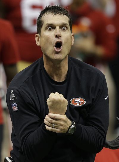 Coach Jim Harbaugh pleads for a holding call on the 49ers’ final play from scrimmage, a fourth-down incompletion. (Associated Press)
