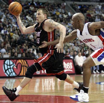 Miami guard Jason Williams drives to the basket past Detroit guard Chauncey Billups.
(Associated Press / The Spokesman-Review)