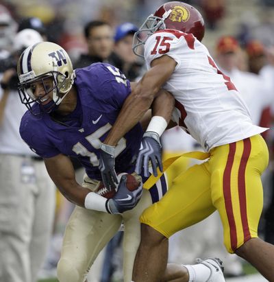 Associated Press Receiver Jermaine Kearse and the Huskies, left, shocked Kevin Thomas and the Trojans last Saturday. (Associated Press / The Spokesman-Review)