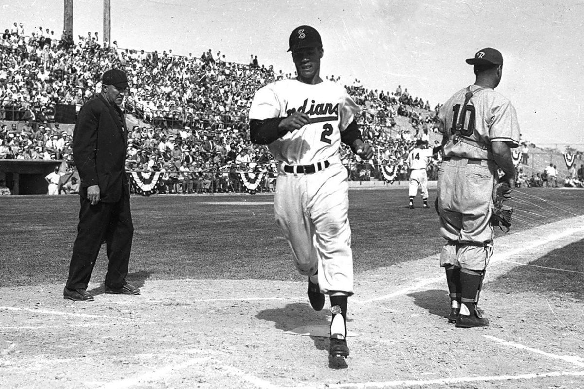 Maury Wills scores for the Spokane Indians during a Pacific Coast League game at Indians ballpark in an undated file photo.  (FILE)