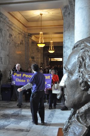Protesters march through the hallways of the Capitol on Thursday, April 7.