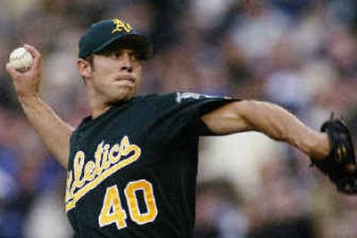 
Rich Harden extended his scoreless innings streak to 15 with seven shutout innings in a 3-0 win over Seattle. 
 (Associated Press / The Spokesman-Review)