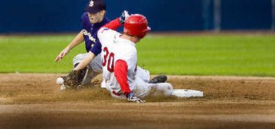 
Greg Biagi covers as the Indians' Grant Gerrard steals second. 
 (Christopher Anderson / The Spokesman-Review)