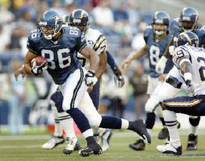 
Seahawks tight end Jerramy Stevens gains 11 yards on a pass from Matt Hasselbeck against the Chargers. Opposing defenses have been forced to account for the productive University of Washington product this season. 
 (Associated Press / The Spokesman-Review)